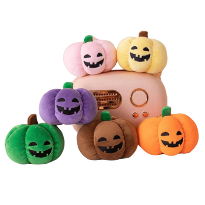 Small dog cuddling a Halloween pumpkin plush toy with night light.