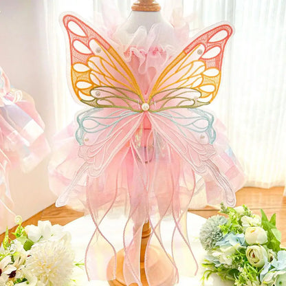 Small dog wearing the Butterfly Princess Dress, showcasing a charming and stylish design perfect for special occasions.