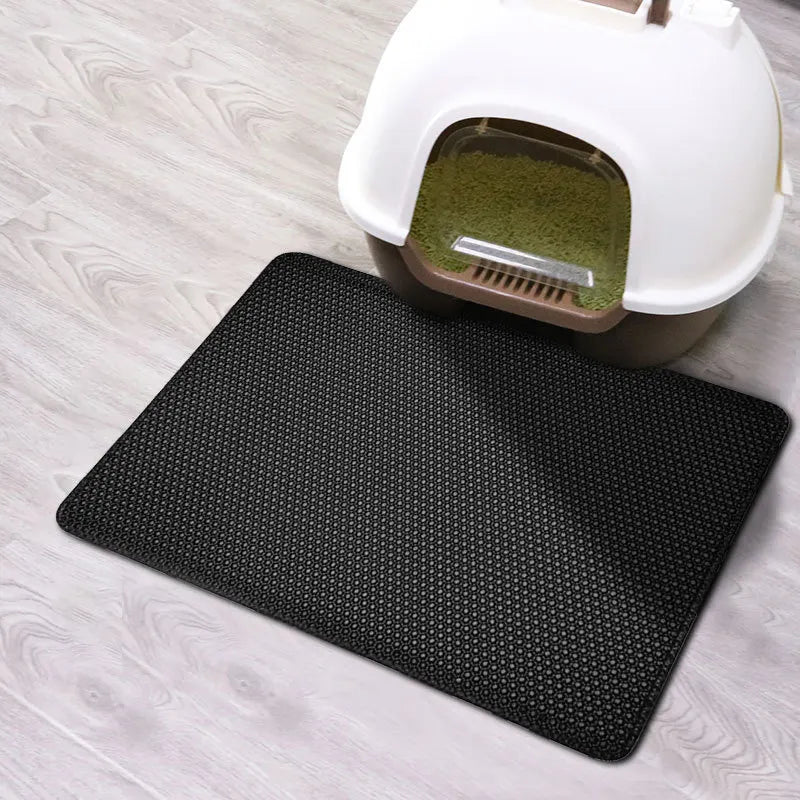 Double layer EVA cat litter mat with waterproof bottom, non-slip surface, and hexagonal holes for litter capture, ideal for maintaining a clean pet area.