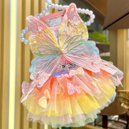Small dog wearing the Butterfly Princess Dress, showcasing a charming and stylish design perfect for special occasions.