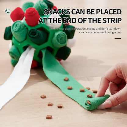 Dog playing with an interactive rubber sniffing ball filled with treats.