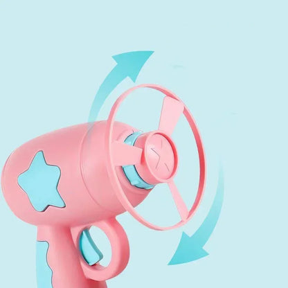 Cat jumping to catch a flying disc launched by interactive cat toy