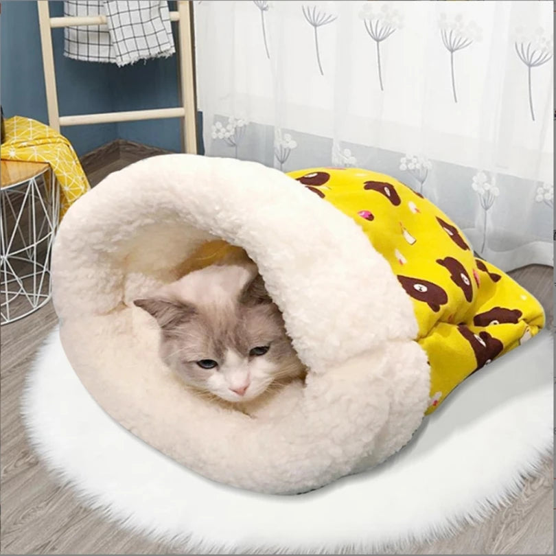 Plush cat sleeping bag with thickened design, providing warmth and comfort for kittens and puppies in winter.