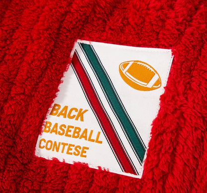 Large dog wearing red Christmas sweater for winter and holiday celebrations