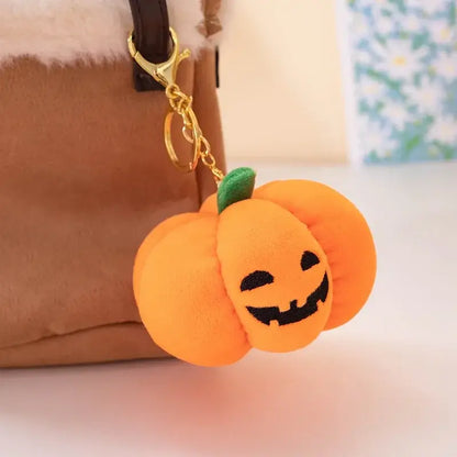 Small dog cuddling a Halloween pumpkin plush toy with night light.
