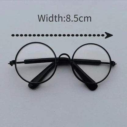 Cat or small dog wearing a shiny satin cape with magical Halloween theme.