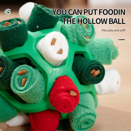 Dog playing with an interactive rubber sniffing ball filled with treats.