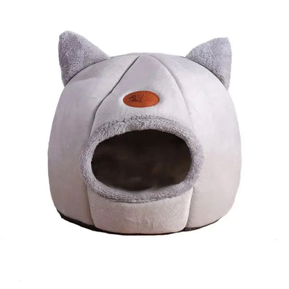 Deep sleep comfort cat bed in cave design, made with soft plush material and non-slip base for warm, cozy winter sleep.