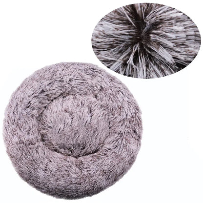 Ultra-soft round plush pet bed for cats and dogs, winter-ready with long plush fabric and non-slip base, available in sizes from 40cm to 90cm.