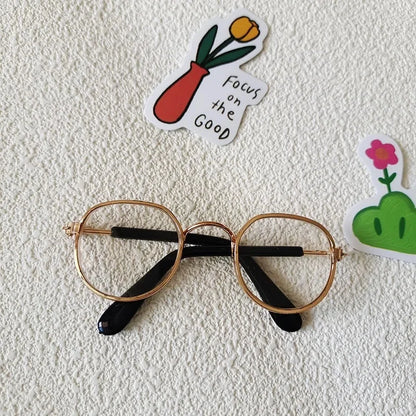 Small dog wearing round wizard cosplay glasses inspired by Harry Potter