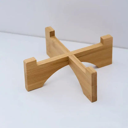 Cat paw-shaped ceramic pet bowl with bamboo stand, perfect for cats and dogs.