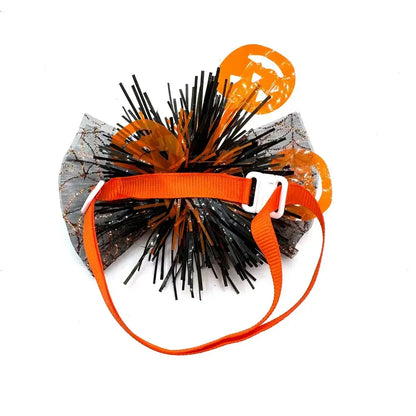 Dog wearing a cute pumpkin and skull Halloween bow tie for festive fun.