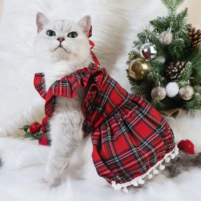 Cat wearing a flannel Christmas hoodie featuring Santa Claus and elk designs, perfect for holiday celebrations.