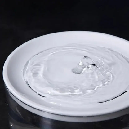 Silent automatic pet water fountain with continuous water flow for cats and dogs.