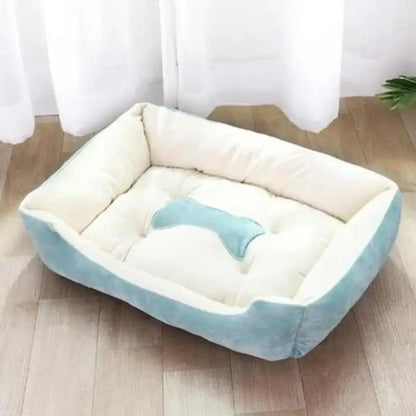 Bone-shaped soft cotton dog bed, washable and breathable with warm padding, designed for year-round comfort and suitable for dogs of all sizes.