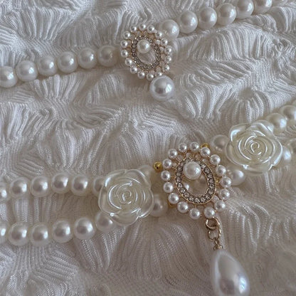 Small dog wearing antique pearl floral necklace with zircon accents