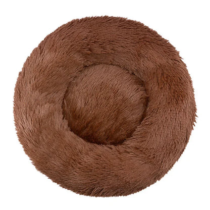 Ultra-soft round plush pet bed for cats and dogs, winter-ready with long plush fabric and non-slip base, available in sizes from 40cm to 90cm.