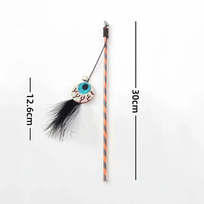 Halloween-themed cat teaser wand with pumpkin, ghost, feathers, and bell.