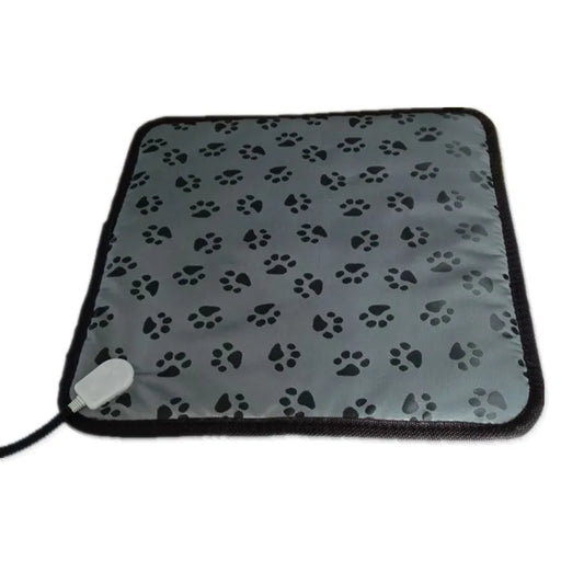 Electric pet heating pad for winter with adjustable temperature, waterproof and anti-bite design for cats and dogs.