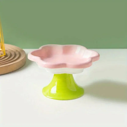 Elevated ceramic cat bowl with elegant flower design for comfortable and healthy feeding.