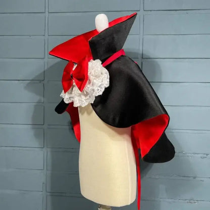 Red and black Halloween vampire cape costume for small to medium dogs, ideal for spooky parties and festive events.