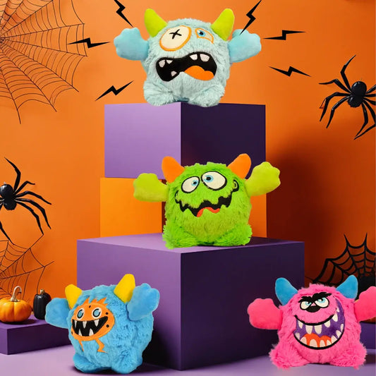 Small dog playing with a Halloween plush squeaky ball that moves.