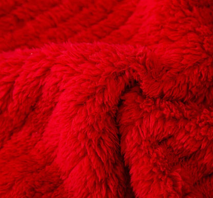 Large dog wearing red Christmas sweater for winter and holiday celebrations