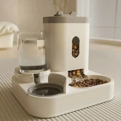 Non-electric automatic pet feeder and water dispenser with raised dual bowl design for cats and dogs.
