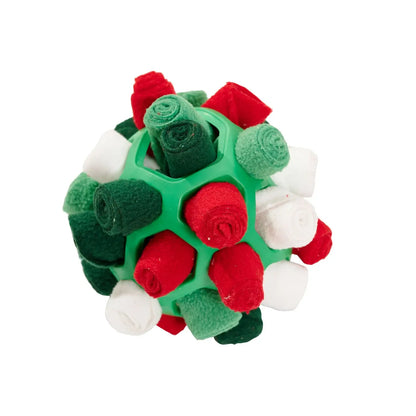 Dog playing with an interactive rubber sniffing ball filled with treats.