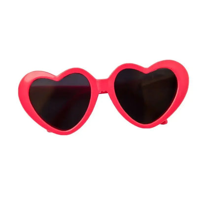 Dog wearing cute heart-shaped sunglasses for outdoor photoshoot or event