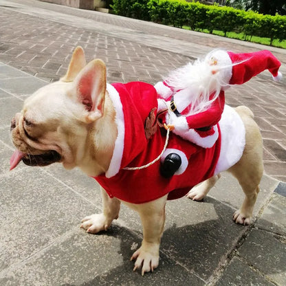 Dog wearing Christmas costume with plush Santa sitting on its back like a rider