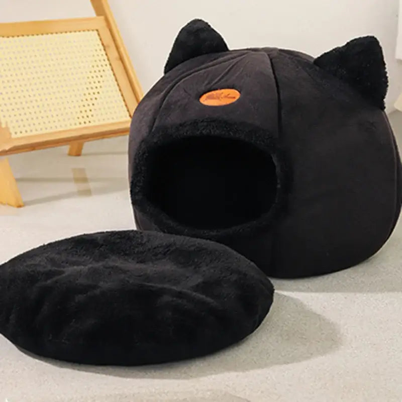 Cozy winter cat bed in cave design with removable cushion, perfect for keeping cats warm and comfortable during cold months.