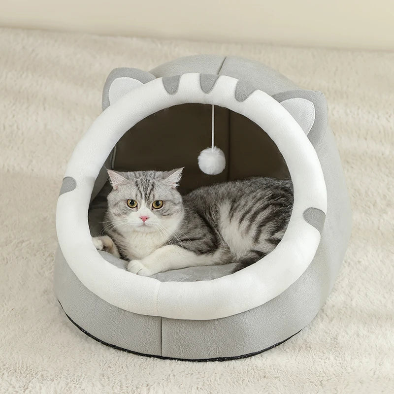 Super cat bed with cave design and plush cushion, providing warmth and comfort for cats during winter.