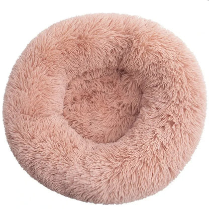 Ultra-soft round plush pet bed for cats and dogs, winter-ready with long plush fabric and non-slip base, available in sizes from 40cm to 90cm.