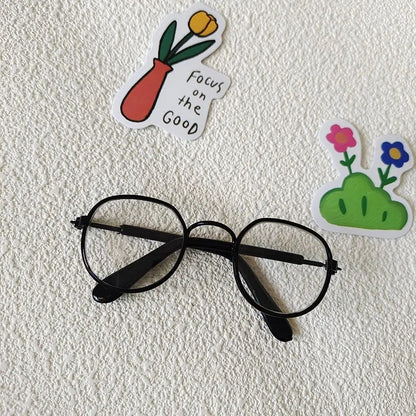 Small dog wearing round wizard cosplay glasses inspired by Harry Potter