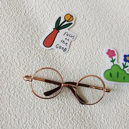 Small dog wearing round wizard cosplay glasses inspired by Harry Potter