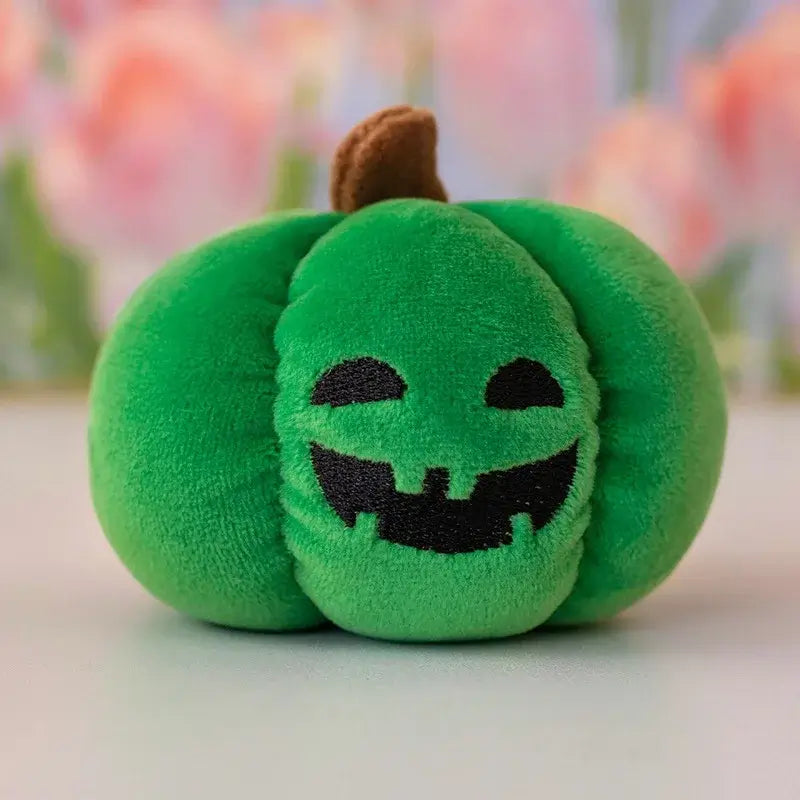 Small dog cuddling a Halloween pumpkin plush toy with night light.