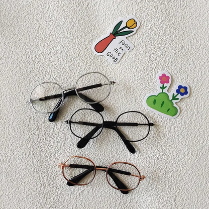 Small dog wearing round wizard cosplay glasses inspired by Harry Potter