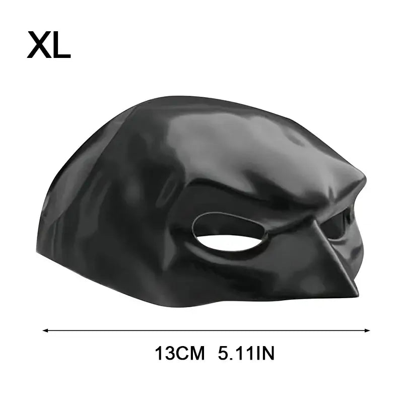 Cat wearing a black bat-inspired superhero mask, posing confidently for Halloween.
