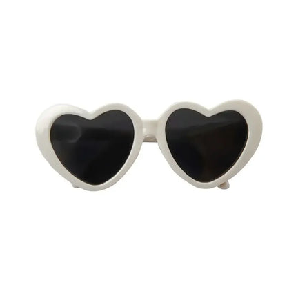 Dog wearing cute heart-shaped sunglasses for outdoor photoshoot or event