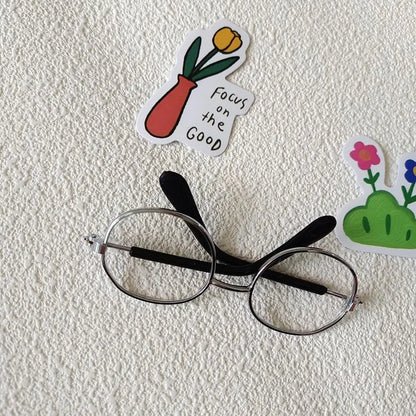 Small dog wearing round wizard cosplay glasses inspired by Harry Potter