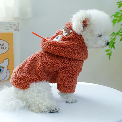 Small dog wearing a thick plush Halloween hoodie coat for chilly weather.