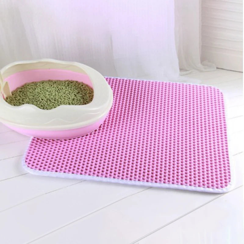 Double layer EVA cat litter mat with waterproof bottom, non-slip surface, and hexagonal holes for litter capture, ideal for maintaining a clean pet area.