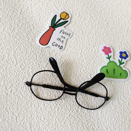 Small dog wearing round wizard cosplay glasses inspired by Harry Potter