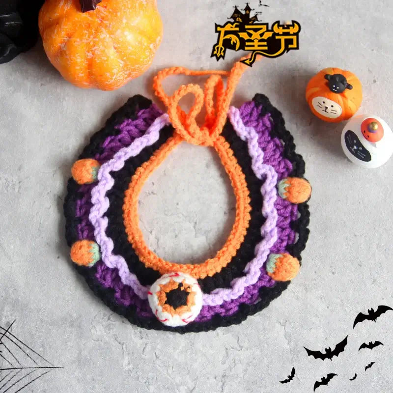 Hand-knit Halloween pet collar bib featuring ghost designs, perfect for dressing up cats and dogs during the spooky season.