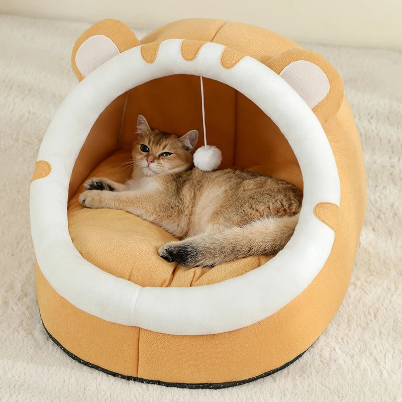 Super cat bed with cave design and plush cushion, providing warmth and comfort for cats during winter.