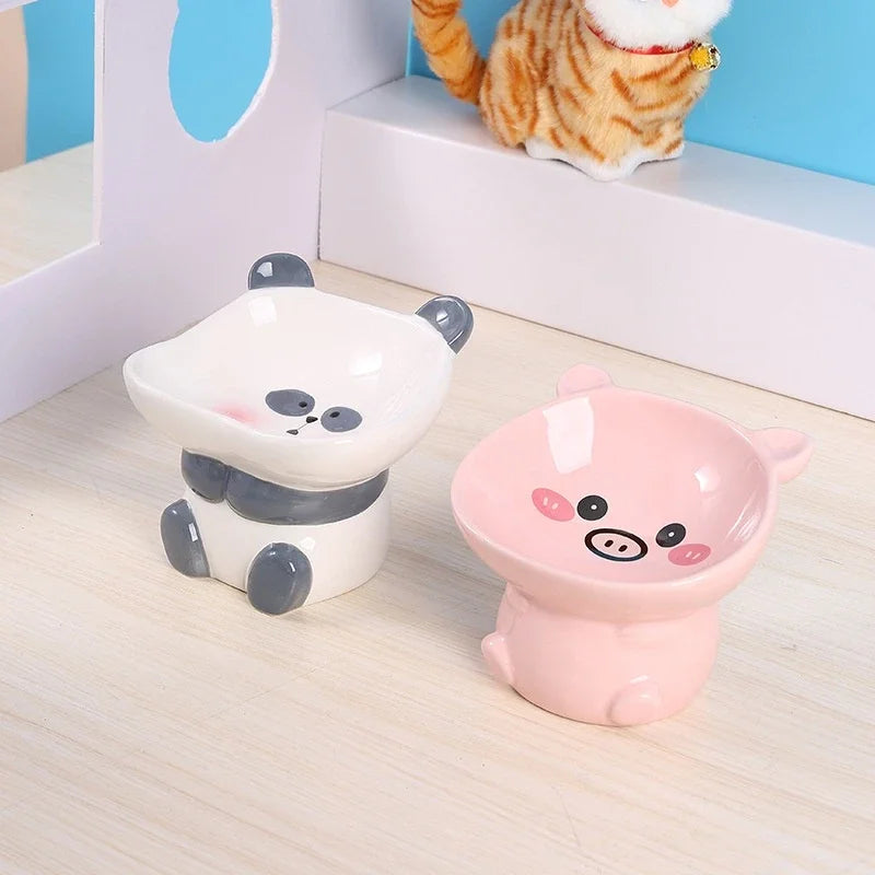 Cute ceramic cartoon pet bowl elevated for cats and small dogs.