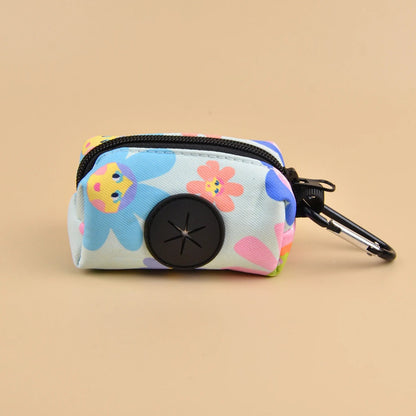 Colorful dog poop bag dispenser with leash clip and stylish print design