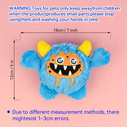 Small dog playing with a Halloween plush squeaky ball that moves.