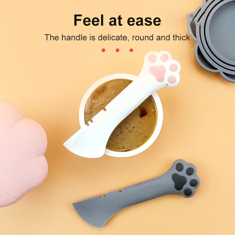 Multifunctional pet spoon and can opener for easy food storage and serving.